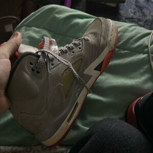 Jordan 5’s older &’ kind of scratched up a bit.